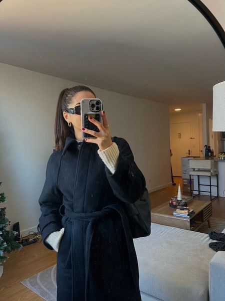 long black coat with a belt tied at the waist. heavy, tailored, so comfortable and warm. perfect for short girls looking for an elevated, classy staple coat! 

#LTKGiftGuide #LTKHoliday #LTKSeasonal