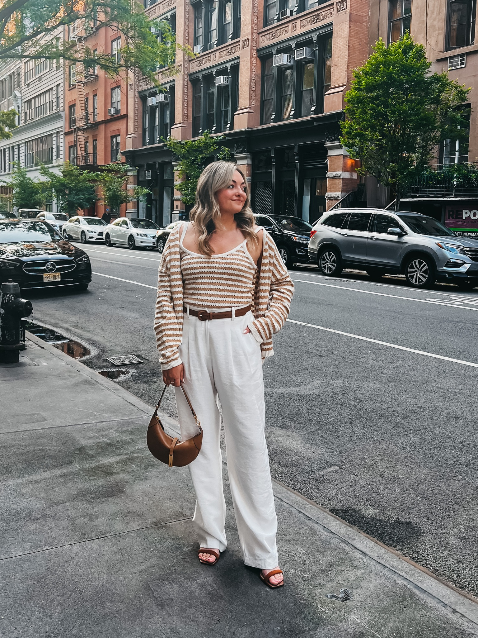 Everything is on sale and we’ll under $100! 
Crochet sweater tank runs a bit small IMO — wearing a large.
Matching striped cardigan is also a Large (went up a size), but I wish I got a Medium.
White trousers are true to size - wearing a Medium. 
Linking all of my exact brown accessories, too!

#LTKunder100 #LTKSeasonal #LTKsalealert